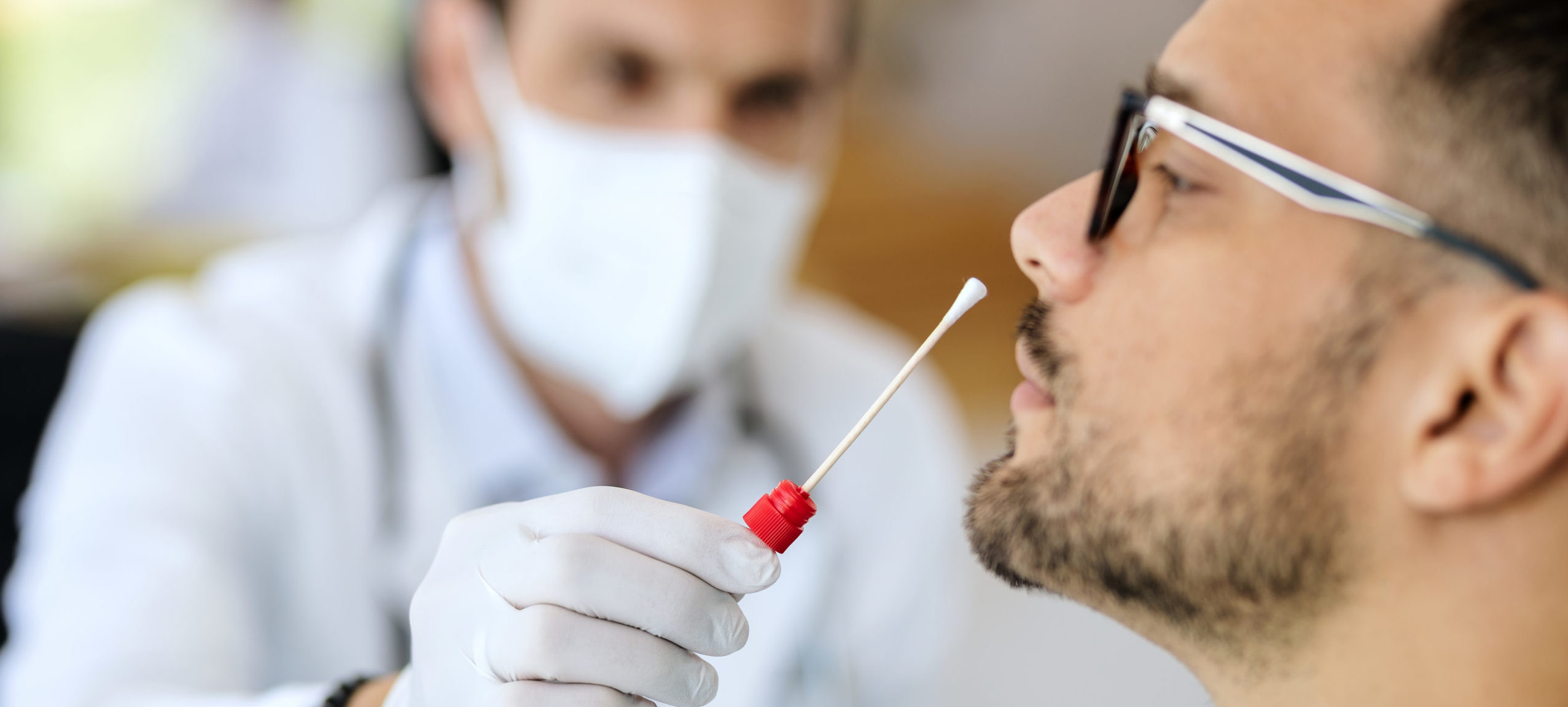 Man getting a covid test via nasal swab