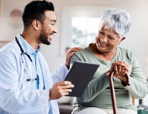 Shot of a young doctor sharing information from his digital tablet with an older patient